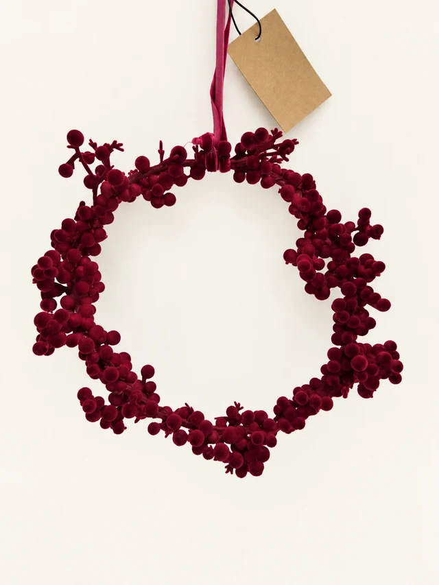 Burgundy flocked foam-ball wreath with hanging ribbon and blank kraft tag