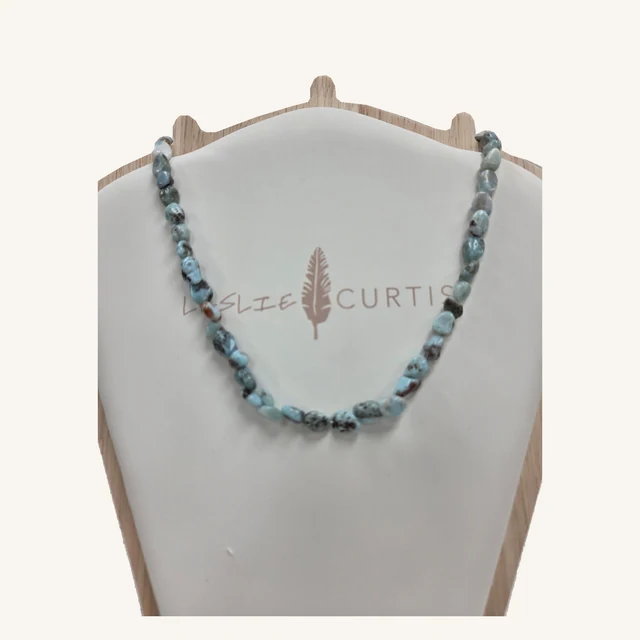 Abigail necklace with irregular polished pale-blue larimar beads on its original Leslie Curtis display