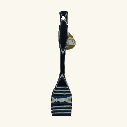Complete blue black and cream Abyss flat cooking spatula with its original attached tag