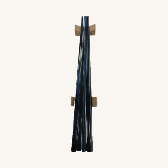 Four Abyss blue-and-black chopsticks in their original close arrangement with both actual wood rests retained