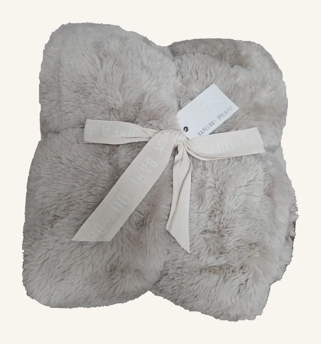 Cloud Faux Fur Throw — Sandstone by Barefoot Dreams, shown folded with original ribbon and tags