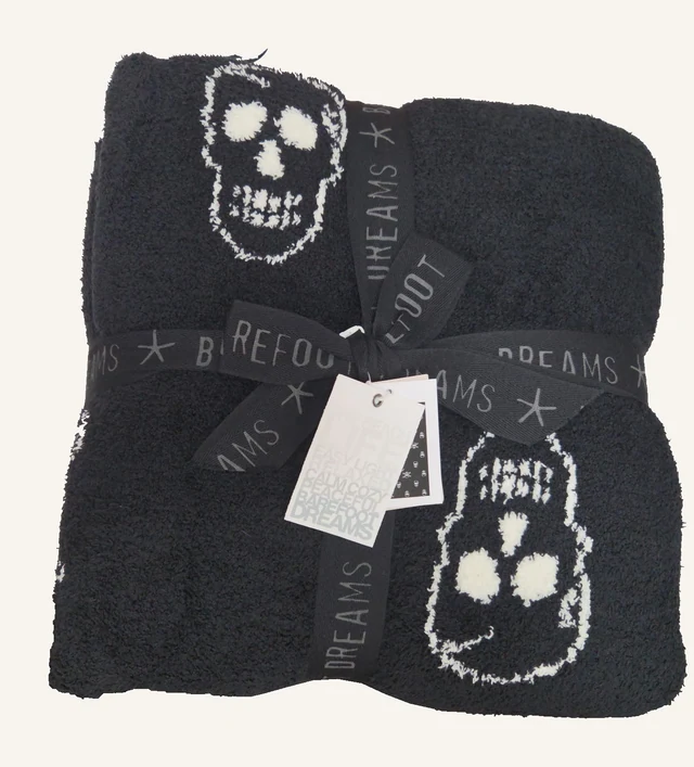 CozyChic Skull Throw — Black–Cream by Barefoot Dreams, shown folded with original ribbon and tags