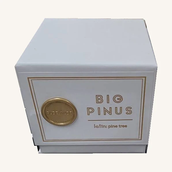 The actual closed Big Pinus candle retail box with its gold lettering, seal and latin pine tree wording