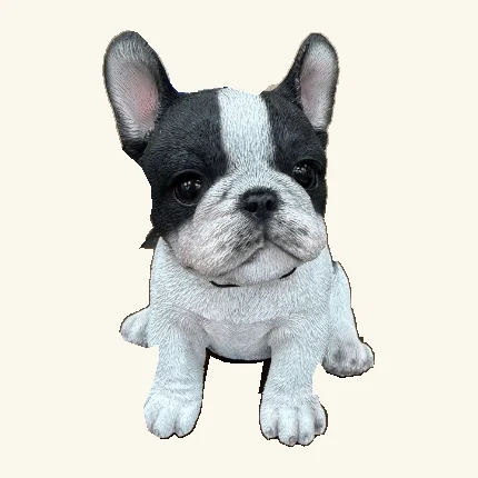 Seated black-and-white French bulldog puppy figurine with upright ears, a white face stripe, white chest and paws, and its original tag edge.