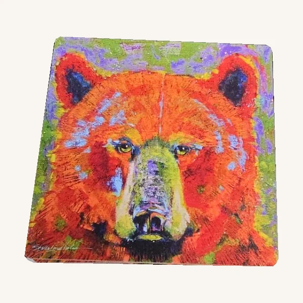 One unwrapped Blaze wood coaster with a colorful bear portrait and complete rounded corners