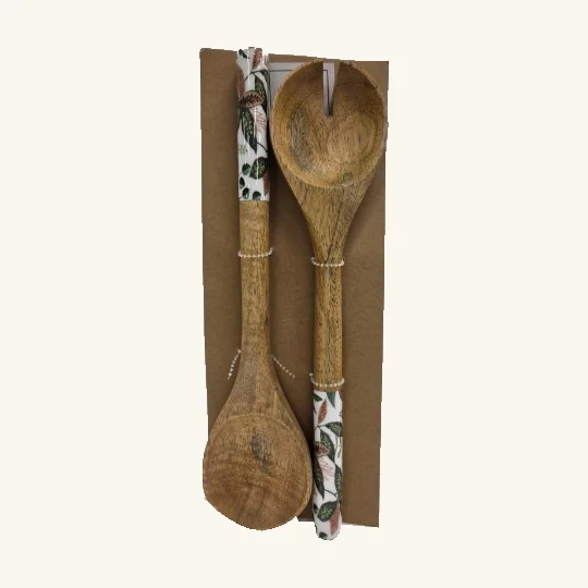 Complete Botanical pair of two solid-bowl serving spoons with pale patterned handles and original backing card
