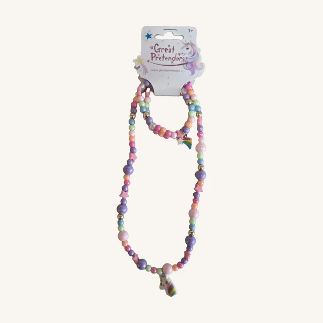 Cheerful Starry Unicorn necklace and bracelet with pastel beads, pink stars, a unicorn-head pendant and a rainbow shooting-star charm on the complete retail card.