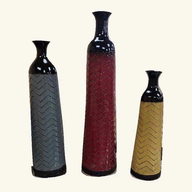 Complete set of three original chevron metal vases: tall burgundy, medium slate gray and small mustard gold, with black necks and bases