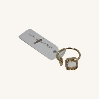 Clara hammered gold-tone ring with its actual square clear-stone setting, band and Leslie Curtis tag
