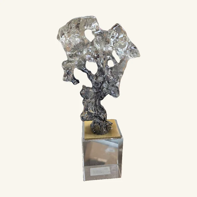 Clear and Smoky Freeform Glass Sculpture. Rippled clear and smoky forms catch the light in a sculptural accent for a console, shelf or tabletop.