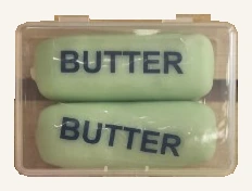 One actual clear case containing two green Crisp Butter toy sticks; colors vary.