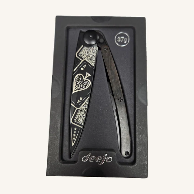 Deejo Good Luck Knife — 37g, Ebony Wood. A compact folding knife pairs an ebony-wood handle with a Good Luck blade design for an everyday utility piece with personality.