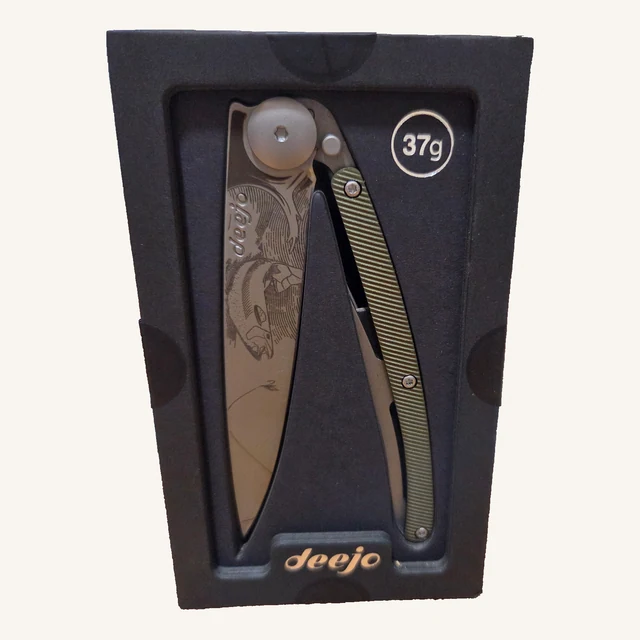 Deejo Trout 37g folding knife with engraved trout blade and textured green-khaki aluminum handle in its black presentation tray