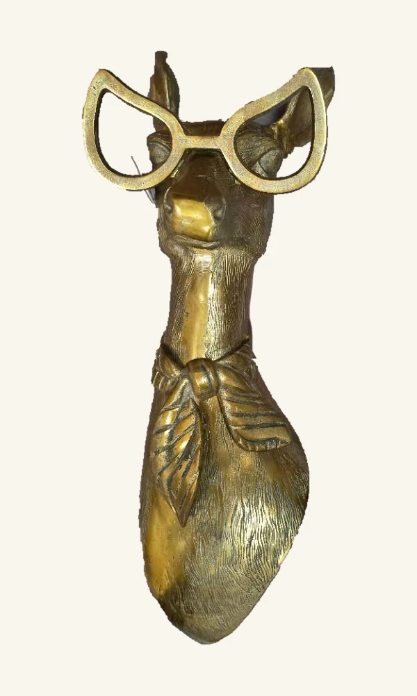 Complete antique-gold Margie doe wall mount with actual cat-eye glasses, long neck, tied scarf, textured finish and clear eyewear fastener
