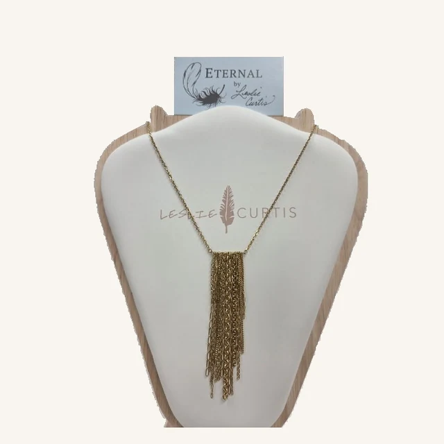 Eliana gold-tone paperclip-chain necklace with a long staggered multi-chain tassel drop on its original Leslie Curtis display