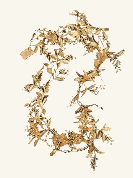 Antique-gold faux foliage garland with varied leaves and small berry clusters