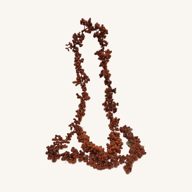 Orange flocked foam ball garland with its actual branching clusters, stems and attached tag