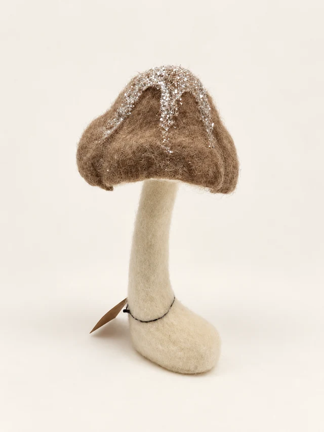 Brown and cream fabric mushroom with silver glitter and a curved base
