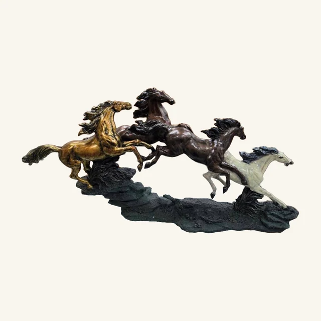 Actual Galloping Horses sculpture with four horses, their full visible tails and legs, and the complete common base