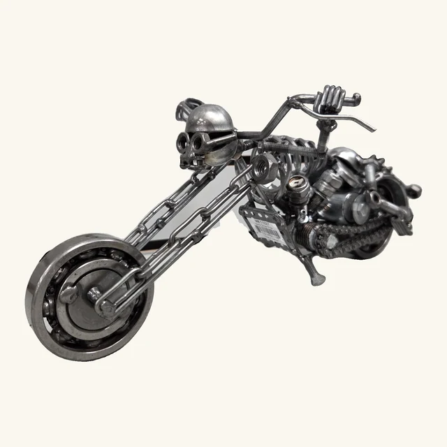 Ghost Rider motorcycle metal sculpture with a skull-faced rider, high handlebar, elongated front forks, complete wheels, original tag and support stand.
