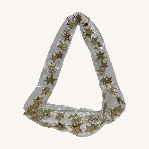 Gold Glitter Paper Star Garland. Small gold-colored glitter stars bring a light, festive accent to a mantel, shelf or seasonal display.
