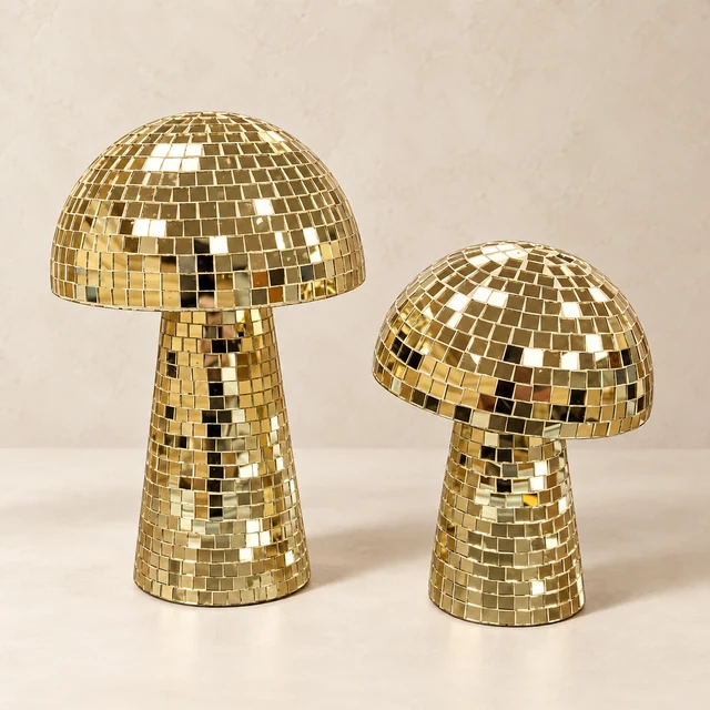 Two gold mirror-mosaic mushroom sculptures in graduated 10-inch and 8-inch heights