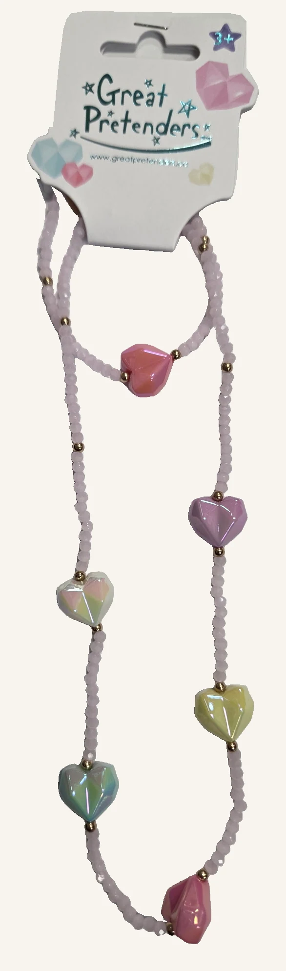 The actual complete Heart Geode necklace and bracelet set with pale pink beads, pastel faceted hearts and gold-tone spacers.