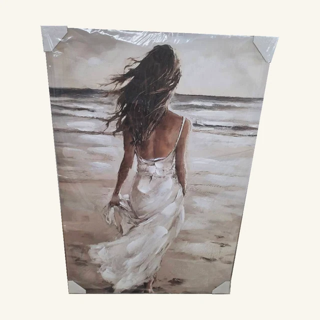 In the Wake of Love. A white dress, windswept hair and an open shoreline give this seaside portrait its gentle movement.