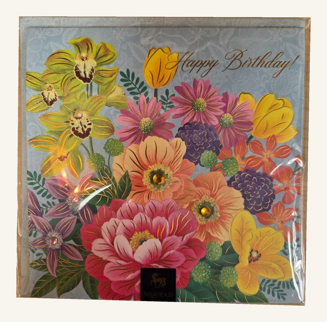 Actual NIQUEA.D Happy Birthday card with colorful flowers and sparkling decorative accents