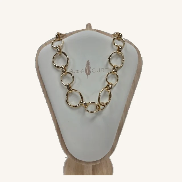 Kirby gold-tone necklace with chunky irregular open links and a toggle closure on its original Leslie Curtis display