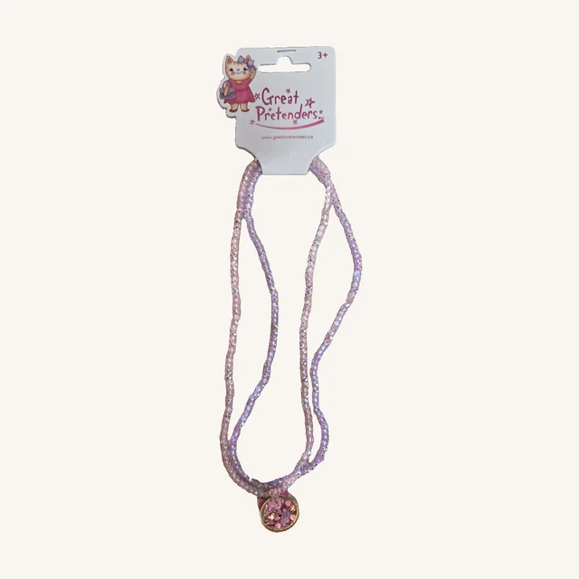 Konfetti Kitty necklace with pink and lilac faceted beads and a round cat-face pendant, shown with its complete kitten-decorated retail card.