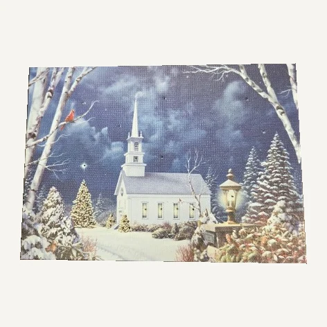 Winter church tabletop canvas with snow-covered trees, a lantern and a red cardinal