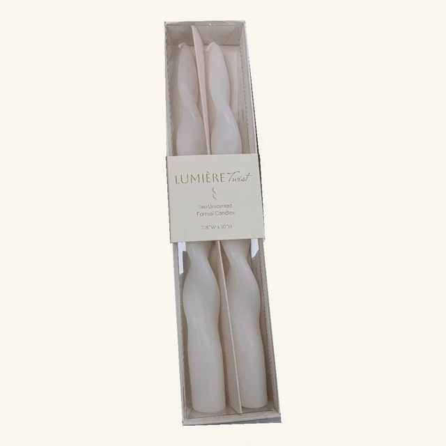 Two white Lumière Twist formal candles in their complete original retail tray and printed sleeve