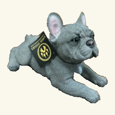 Gray French bulldog figurine lying with upright ears, complete visible paws, tag and neck cord.