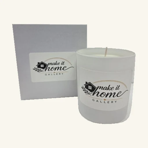 Complete white Make It Home Gallery candle with its original printed gallery label, wax, wick and matching gray box