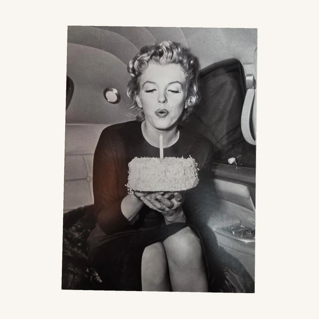 Marilyn Monroe birthday card with a black-and-white photograph of Marilyn holding a cake with a single candle.