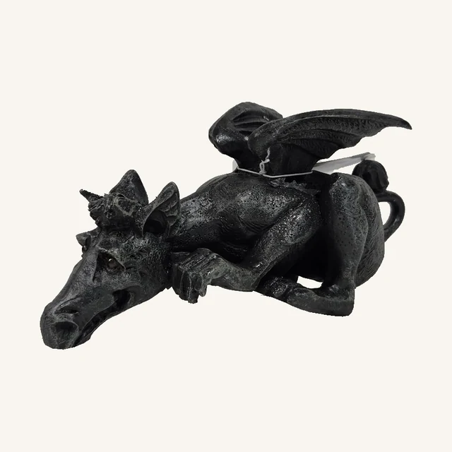 One dark crouching Martingale dragon sculpture with a lowered long snout, folded wings, crossed front claws, curled tail and original attached cord and tag