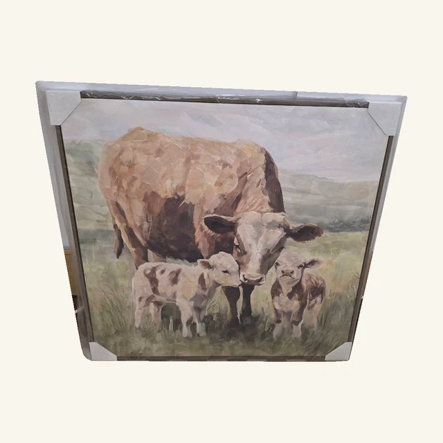 Motherly Love. A cow and her calves stand together in a softly colored country scene.