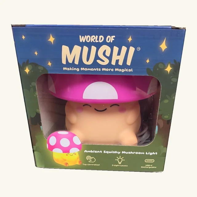 Pink Mushi mushroom light in its original illustrated retail box, with its smiling face and coiled lead visible through the window.
