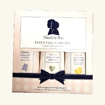 Complete Noodle & Boo Essential Care Kit window box with three original products and navy bow design