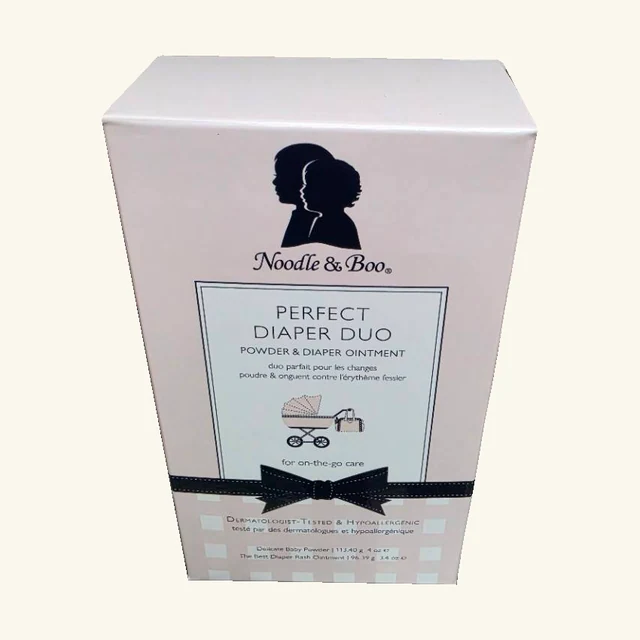 Complete Noodle & Boo Perfect Diaper Duo retail box with original pram illustration and navy bow design