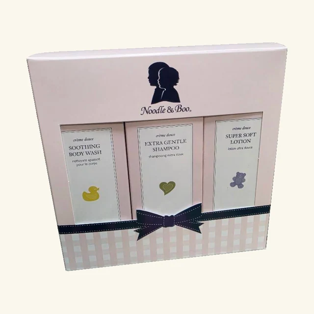 Complete pink Noodle & Boo Starter Gift Set window box with three original products and navy bow design