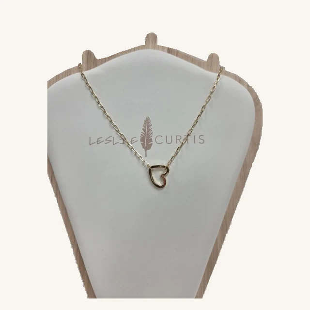 Parker gold-tone necklace with an irregular open-heart pendant and oval-link chain on its original Leslie Curtis display