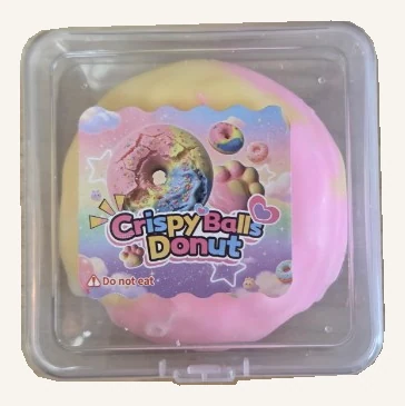 Pastel rainbow doughnut squishy toy in its complete clear case with the original Crispy Balls Donut label.