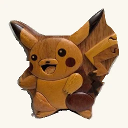 Pikachu-shaped wooden puzzle box with contrasting wood inlays, pointed ears, round cheeks, feet and a layered zigzag tail.