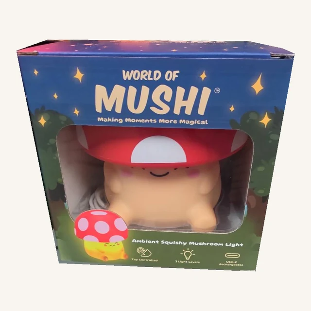 Red Mushi mushroom light and its cable visible through the original retail-box window