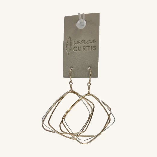 Regina Mixed-Metal Hoop Earrings. Layered gold- and silver-toned loops give these two-inch earrings an airy, sculptural shape.