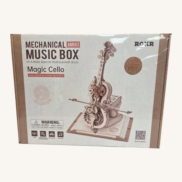 Complete retail box of the Magic Cello Mechanical Music Box Kit, with its original printed artwork and model details.