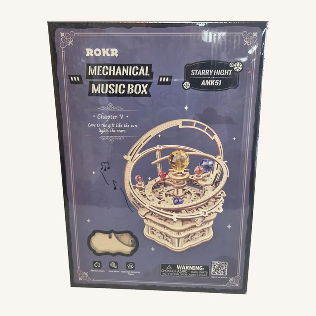 Complete retail box of the Starry Night Mechanical Music Box Kit, with its original printed artwork and model details.