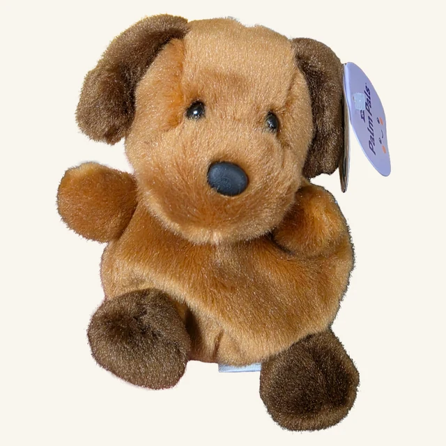 Actual tan Ruff Ruff puppy plush with brown ears and feet, original Palm Pals paper tag and lower fabric label